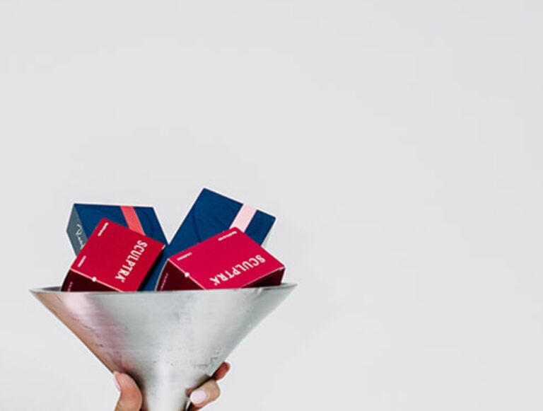 Sculptra biostimulator boxes in a silver martini glass
