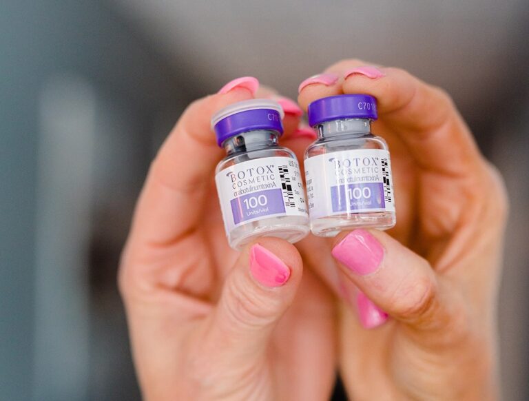 Botox vials held in hands