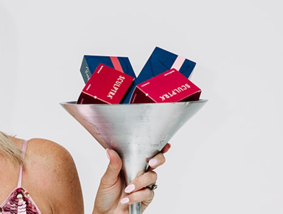 Martini glass filled with Sculptra boxes