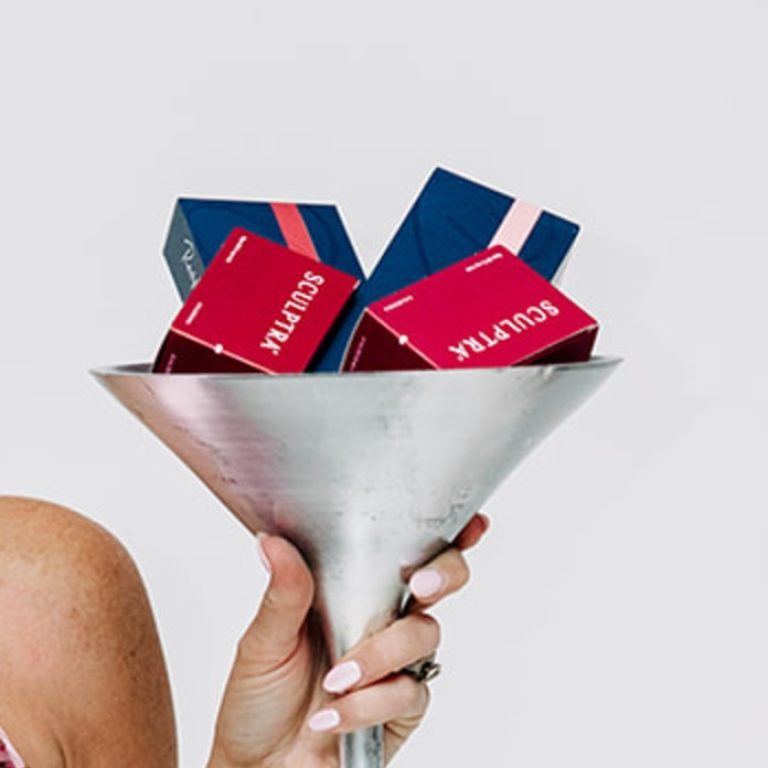 Martini glass filled with Sculptra boxes