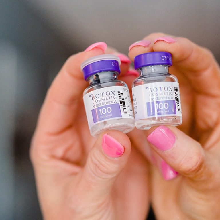 Botox vials held in hands